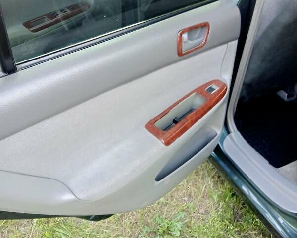Зелений Тойота Камрі, об'ємом двигуна 2.36 л та пробігом 270 тис. км за 5300 $, фото 4 на Automoto.ua