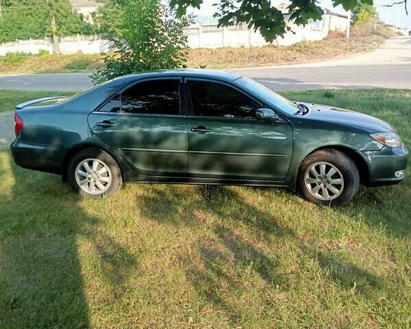 Зелений Тойота Камрі, об'ємом двигуна 2.36 л та пробігом 270 тис. км за 5300 $, фото 12 на Automoto.ua