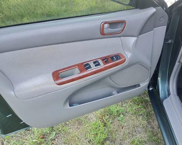 Зелений Тойота Камрі, об'ємом двигуна 2.36 л та пробігом 270 тис. км за 5300 $, фото 5 на Automoto.ua