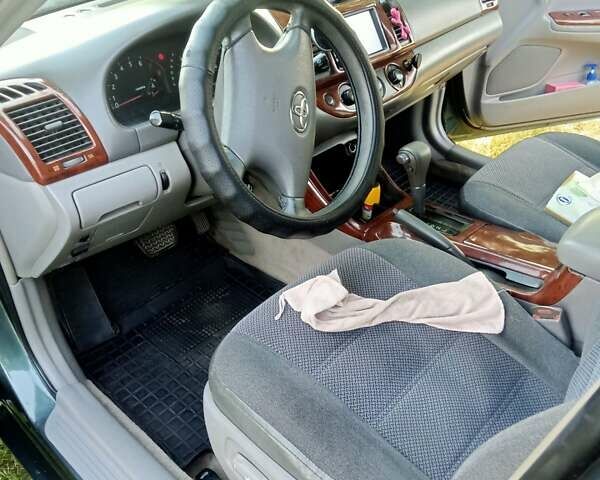 Зелений Тойота Камрі, об'ємом двигуна 2.36 л та пробігом 270 тис. км за 5300 $, фото 7 на Automoto.ua