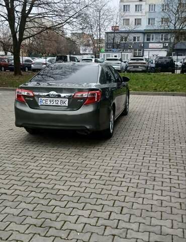 Зеленый Тойота Камри, объемом двигателя 2.5 л и пробегом 230 тыс. км за 11300 $, фото 7 на Automoto.ua