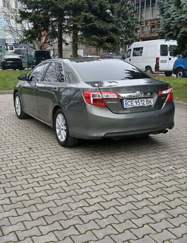 Зеленый Тойота Камри, объемом двигателя 2.5 л и пробегом 230 тыс. км за 11300 $, фото 1 на Automoto.ua