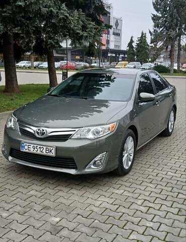 Зеленый Тойота Камри, объемом двигателя 2.5 л и пробегом 230 тыс. км за 11300 $, фото 9 на Automoto.ua