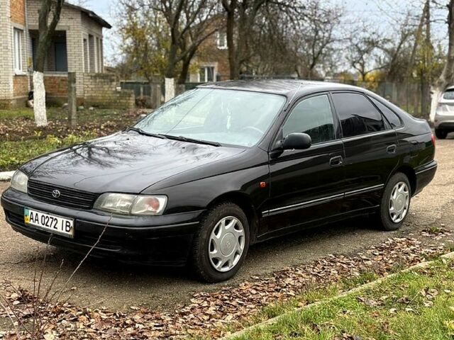 Черный Тойота Карина, объемом двигателя 1.8 л и пробегом 210 тыс. км за 1799 $, фото 2 на Automoto.ua