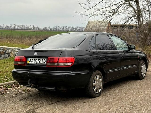 Черный Тойота Карина, объемом двигателя 1.8 л и пробегом 210 тыс. км за 1799 $, фото 4 на Automoto.ua