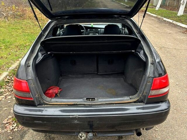 Черный Тойота Карина, объемом двигателя 1.8 л и пробегом 210 тыс. км за 1799 $, фото 9 на Automoto.ua