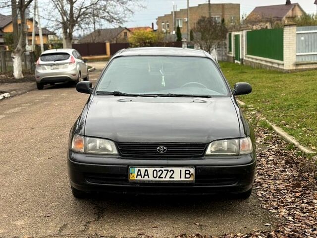 Черный Тойота Карина, объемом двигателя 1.8 л и пробегом 210 тыс. км за 1799 $, фото 1 на Automoto.ua