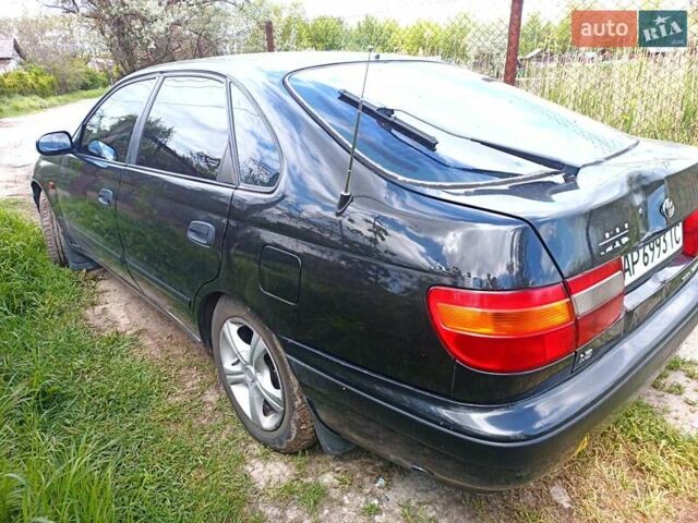 Черный Тойота Карина, объемом двигателя 1.76 л и пробегом 293 тыс. км за 2650 $, фото 5 на Automoto.ua
