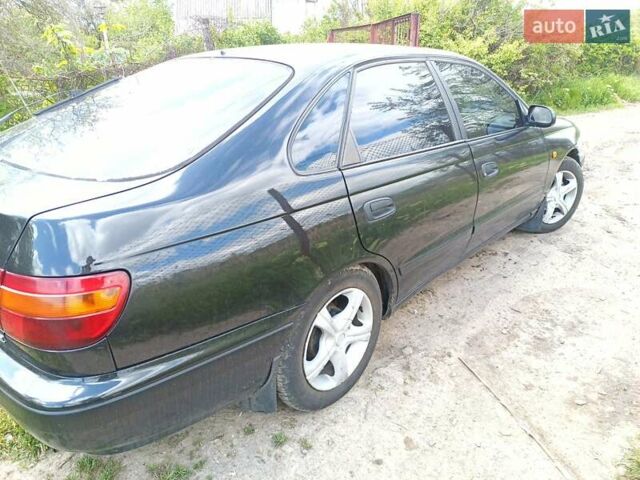 Черный Тойота Карина, объемом двигателя 1.76 л и пробегом 293 тыс. км за 2650 $, фото 2 на Automoto.ua