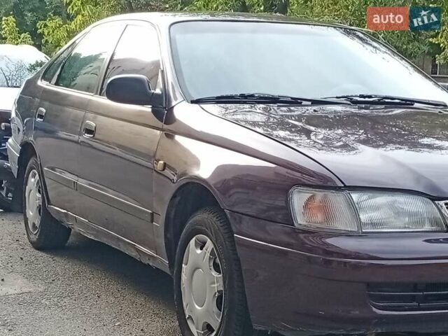 Фиолетовый Тойота Карина, объемом двигателя 1.6 л и пробегом 443 тыс. км за 1800 $, фото 1 на Automoto.ua