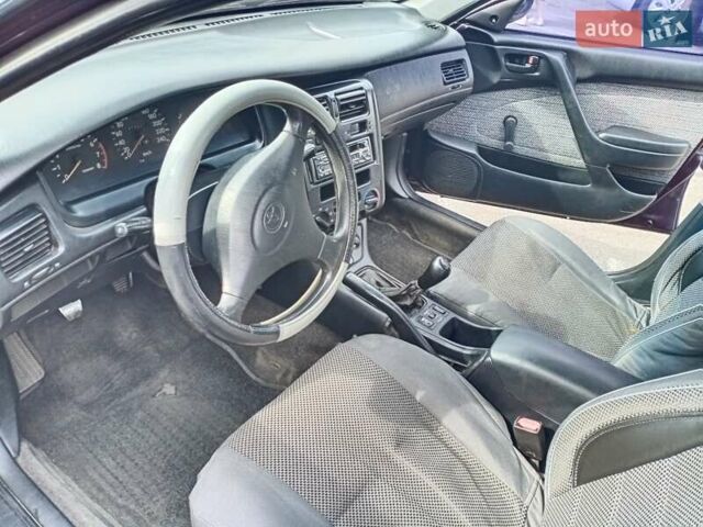 Фиолетовый Тойота Карина, объемом двигателя 1.6 л и пробегом 443 тыс. км за 1800 $, фото 4 на Automoto.ua