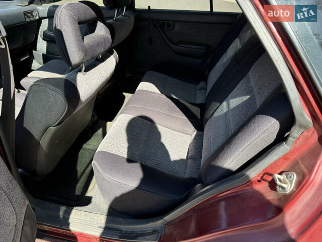 Красный Тойота Карина, объемом двигателя 2 л и пробегом 333 тыс. км за 1375 $, фото 9 на Automoto.ua