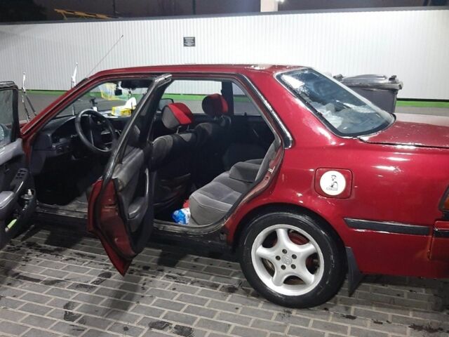 Красный Тойота Карина, объемом двигателя 2 л и пробегом 350 тыс. км за 1600 $, фото 1 на Automoto.ua