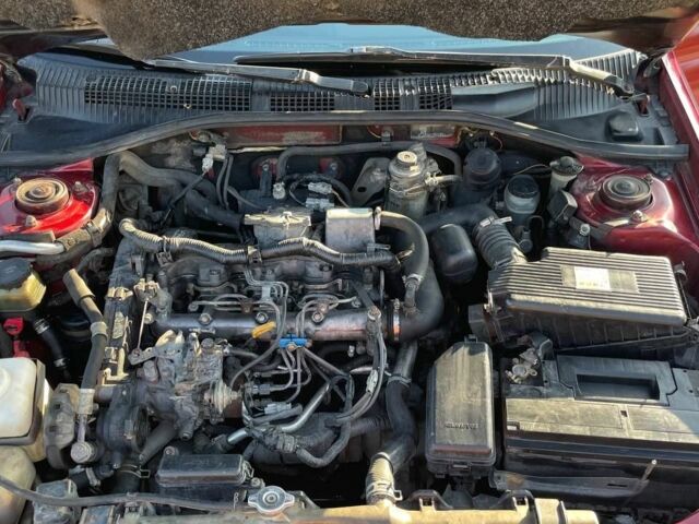 Красный Тойота Карина, объемом двигателя 2 л и пробегом 320 тыс. км за 3500 $, фото 4 на Automoto.ua