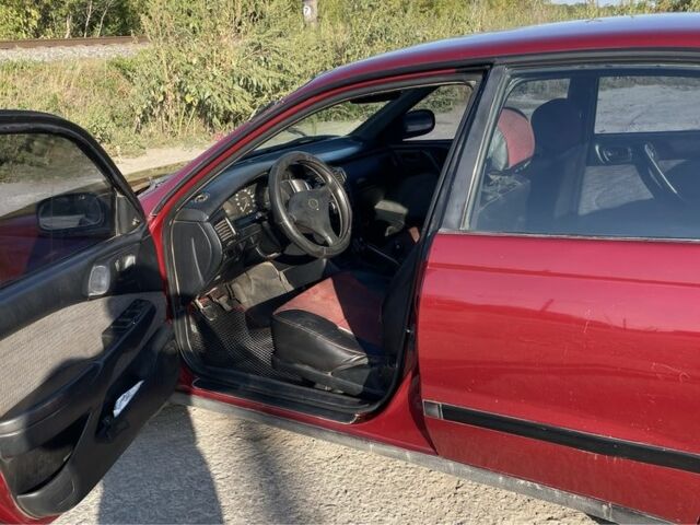 Красный Тойота Карина, объемом двигателя 2 л и пробегом 380 тыс. км за 2500 $, фото 5 на Automoto.ua