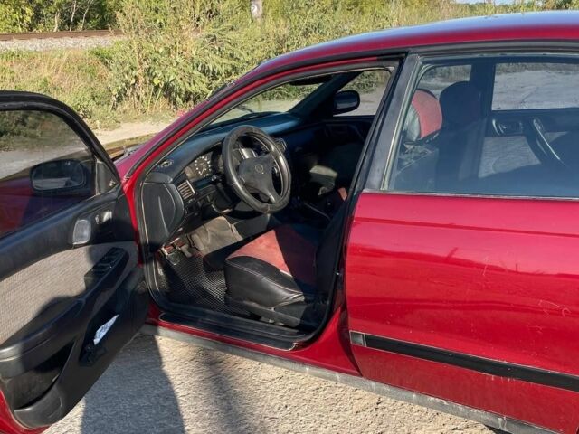Красный Тойота Карина, объемом двигателя 2 л и пробегом 320 тыс. км за 3500 $, фото 8 на Automoto.ua