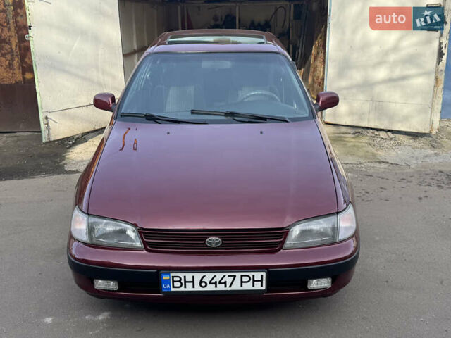 Красный Тойота Карина, объемом двигателя 1.6 л и пробегом 259 тыс. км за 2800 $, фото 1 на Automoto.ua