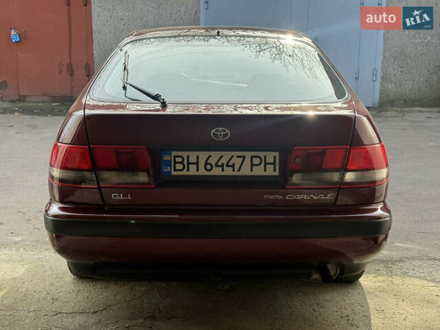 Красный Тойота Карина, объемом двигателя 1.6 л и пробегом 259 тыс. км за 2800 $, фото 4 на Automoto.ua