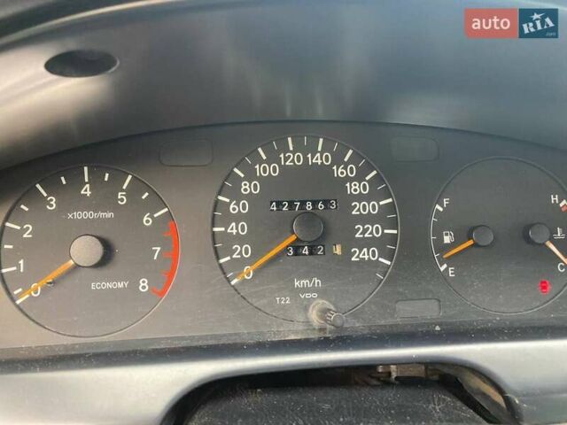 Красный Тойота Карина, объемом двигателя 1.76 л и пробегом 428 тыс. км за 2800 $, фото 1 на Automoto.ua