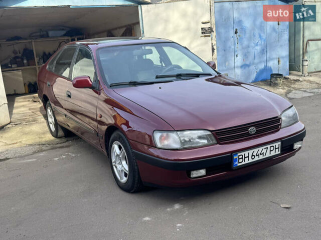 Красный Тойота Карина, объемом двигателя 1.6 л и пробегом 259 тыс. км за 2800 $, фото 3 на Automoto.ua