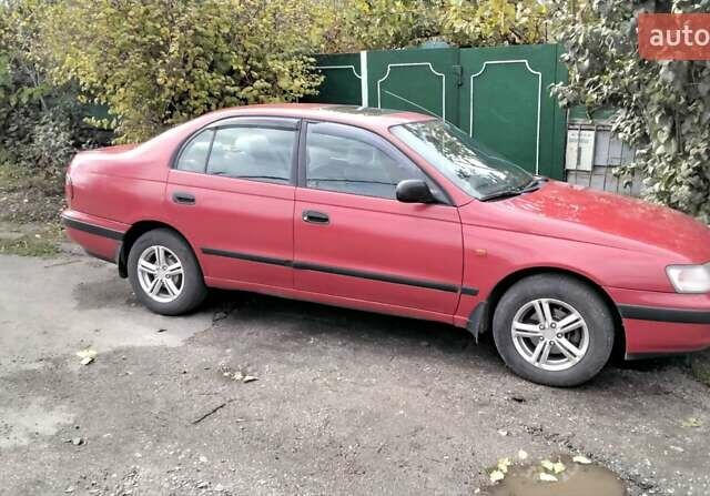 Красный Тойота Карина, объемом двигателя 1.76 л и пробегом 428 тыс. км за 2800 $, фото 13 на Automoto.ua