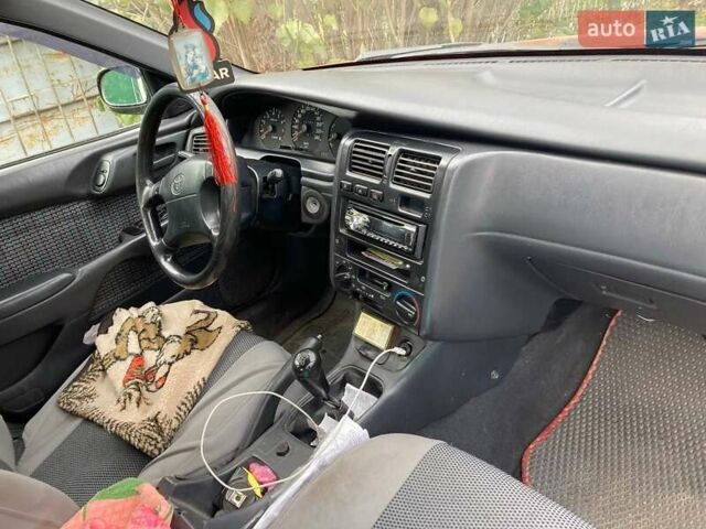 Красный Тойота Карина, объемом двигателя 1.76 л и пробегом 428 тыс. км за 2800 $, фото 2 на Automoto.ua