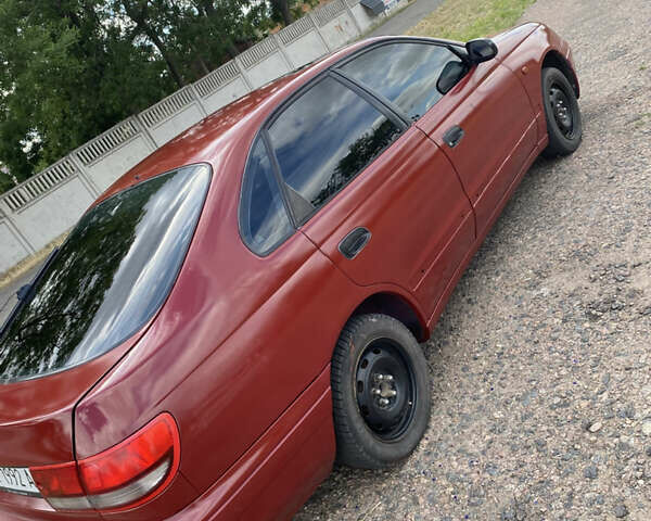 Червоний Тойота Каріна, об'ємом двигуна 1.6 л та пробігом 260 тис. км за 2100 $, фото 3 на Automoto.ua