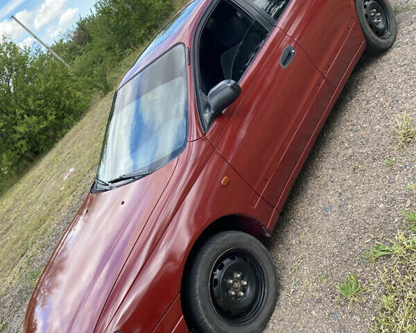 Червоний Тойота Каріна, об'ємом двигуна 1.6 л та пробігом 260 тис. км за 2100 $, фото 1 на Automoto.ua