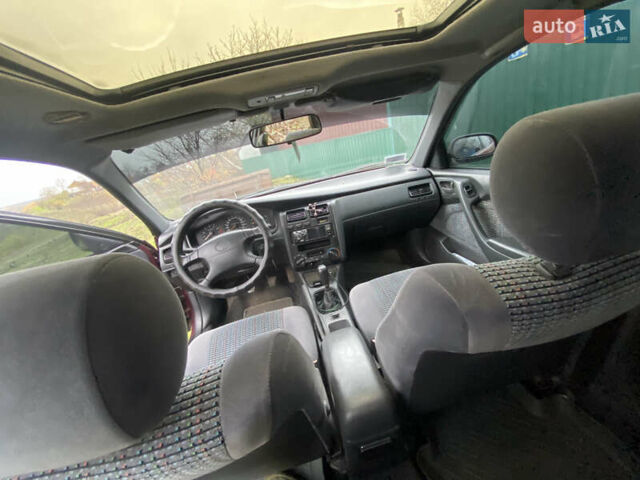 Червоний Тойота Каріна, об'ємом двигуна 1.6 л та пробігом 260 тис. км за 2100 $, фото 4 на Automoto.ua