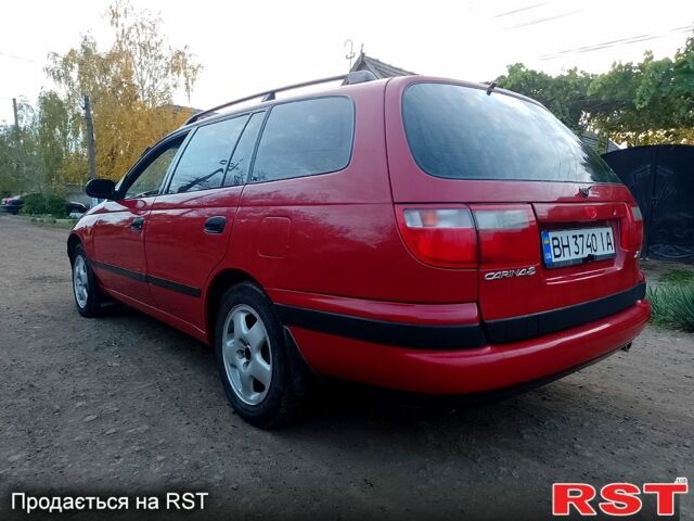 Червоний Тойота Каріна, об'ємом двигуна 1.6 л та пробігом 111 тис. км за 1999 $, фото 4 на Automoto.ua