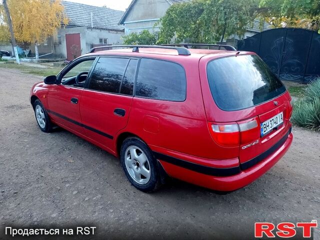 Червоний Тойота Каріна, об'ємом двигуна 1.6 л та пробігом 111 тис. км за 1999 $, фото 9 на Automoto.ua