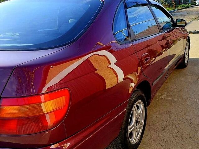 Красный Тойота Карина, объемом двигателя 1.8 л и пробегом 344 тыс. км за 3100 $, фото 3 на Automoto.ua