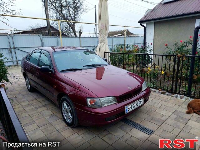 Красный Тойота Карина, объемом двигателя 1.8 л и пробегом 344 тыс. км за 3100 $, фото 1 на Automoto.ua