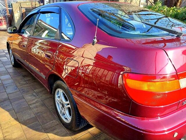 Красный Тойота Карина, объемом двигателя 1.8 л и пробегом 344 тыс. км за 3100 $, фото 2 на Automoto.ua