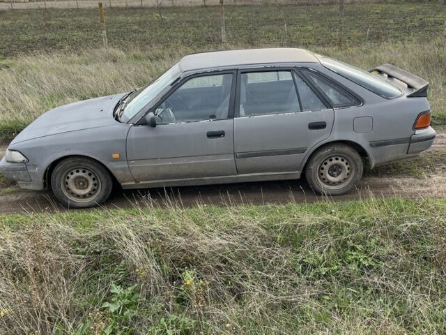 Серый Тойота Карина, объемом двигателя 1.6 л и пробегом 220 тыс. км за 1300 $, фото 2 на Automoto.ua