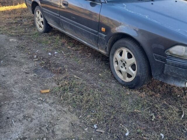 Серый Тойота Карина, объемом двигателя 1.6 л и пробегом 2 тыс. км за 800 $, фото 1 на Automoto.ua