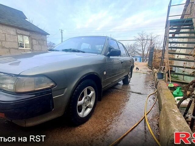 Серый Тойота Карина, объемом двигателя 2 л и пробегом 268 тыс. км за 2300 $, фото 1 на Automoto.ua