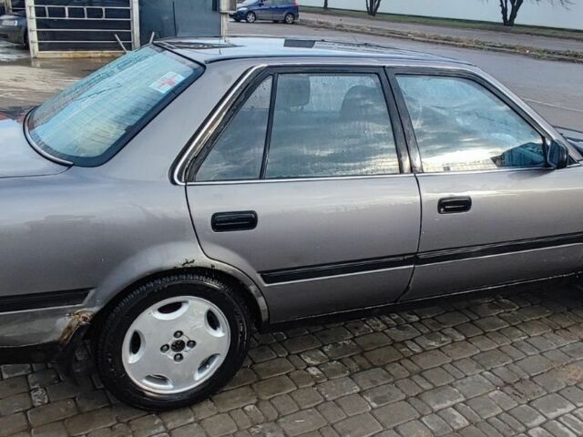 Серый Тойота Карина, объемом двигателя 1.6 л и пробегом 370 тыс. км за 952 $, фото 2 на Automoto.ua