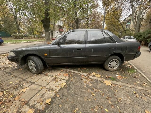 Серый Тойота Карина, объемом двигателя 1.6 л и пробегом 180 тыс. км за 700 $, фото 1 на Automoto.ua