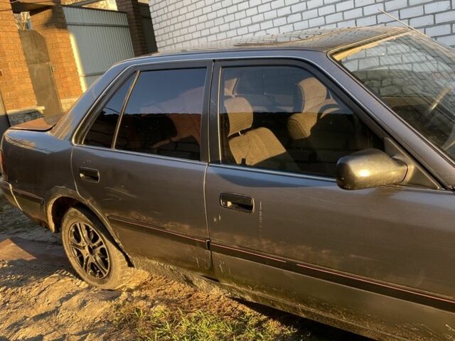 Серый Тойота Карина, объемом двигателя 1.6 л и пробегом 500 тыс. км за 600 $, фото 7 на Automoto.ua