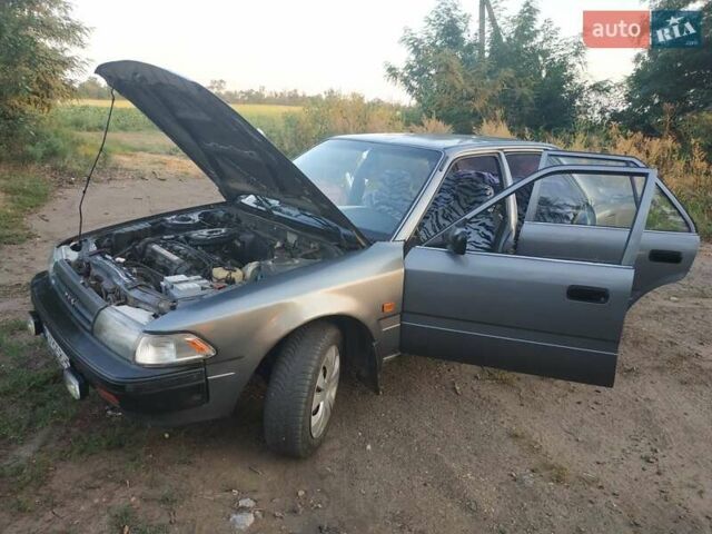 Серый Тойота Карина, объемом двигателя 1.59 л и пробегом 185 тыс. км за 1800 $, фото 1 на Automoto.ua