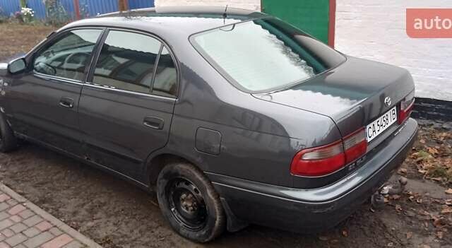 Серый Тойота Карина, объемом двигателя 2 л и пробегом 404 тыс. км за 2999 $, фото 3 на Automoto.ua