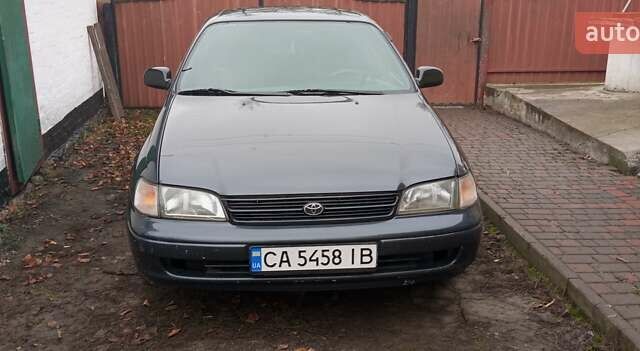 Серый Тойота Карина, объемом двигателя 2 л и пробегом 404 тыс. км за 2999 $, фото 1 на Automoto.ua