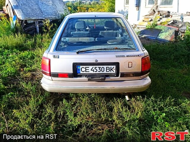 Серый Тойота Карина, объемом двигателя 1.6 л и пробегом 230 тыс. км за 560 $, фото 3 на Automoto.ua