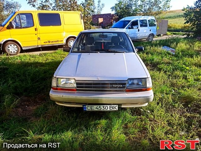 Серый Тойота Карина, объемом двигателя 1.6 л и пробегом 230 тыс. км за 560 $, фото 1 на Automoto.ua