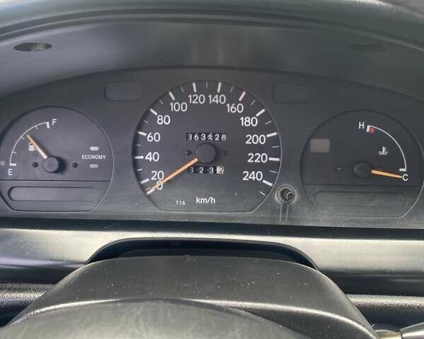 Синий Тойота Карина, объемом двигателя 1.59 л и пробегом 368 тыс. км за 2300 $, фото 1 на Automoto.ua