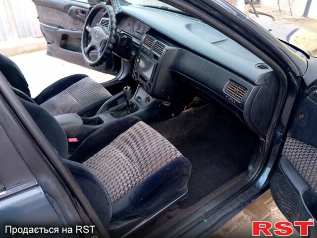 Синій Тойота Каріна, об'ємом двигуна 2 л та пробігом 200 тис. км за 1600 $, фото 11 на Automoto.ua