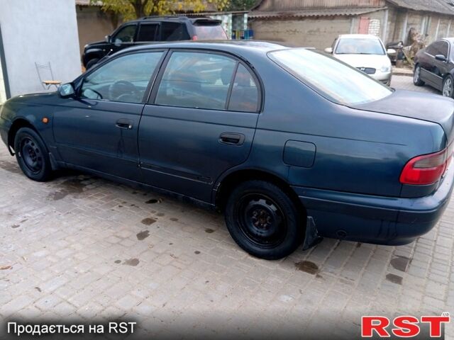 Синій Тойота Каріна, об'ємом двигуна 2 л та пробігом 200 тис. км за 1600 $, фото 6 на Automoto.ua