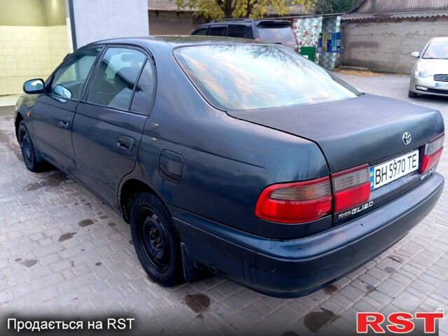Синій Тойота Каріна, об'ємом двигуна 2 л та пробігом 200 тис. км за 1600 $, фото 5 на Automoto.ua