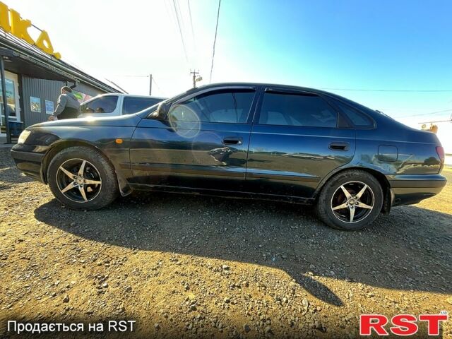 Зеленый Тойота Карина, объемом двигателя 2 л и пробегом 417 тыс. км за 2000 $, фото 2 на Automoto.ua